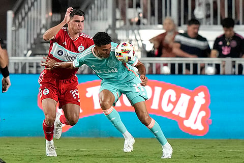 Ian Fray heads the ball as Georgios Koutsias defends